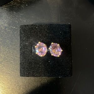 Light purple stone earrings set in gold. I believe they are cz but not 100% sure